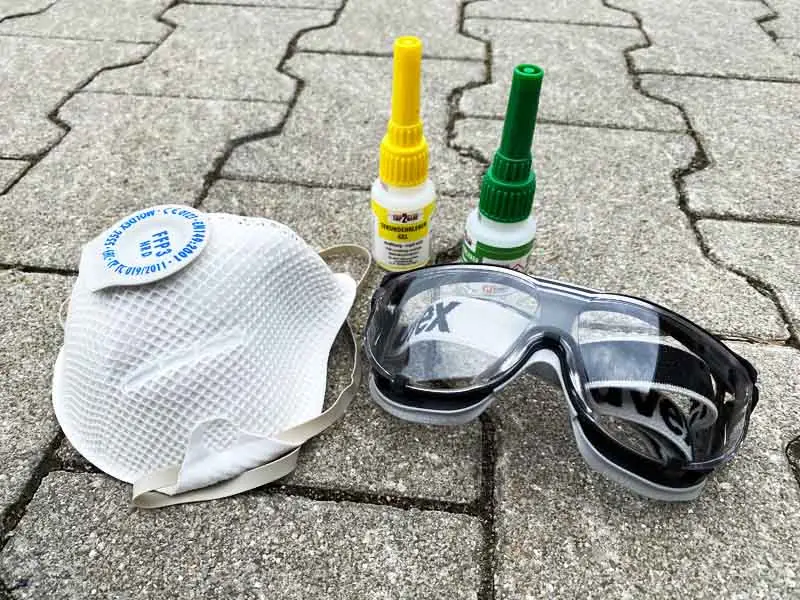 Lunettes de protection, colle instantanée et masque FFP3.